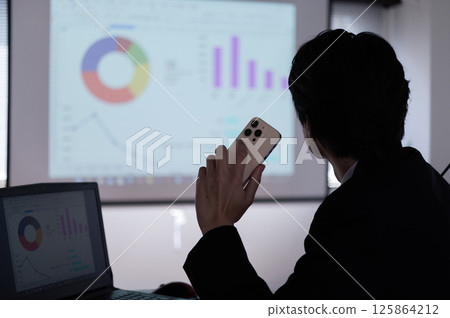 A man in a suit having trouble at work A man in a suit having trouble at work 125864212