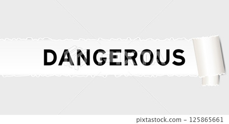 Ripped gray paper background that have word dangerous under torn part 125865661