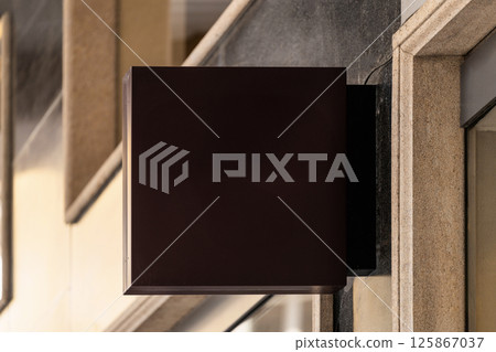 Blank square sign on urban building wall at daytime, mockup Blank square sign on urban building wall at daytime, mockup 125867037