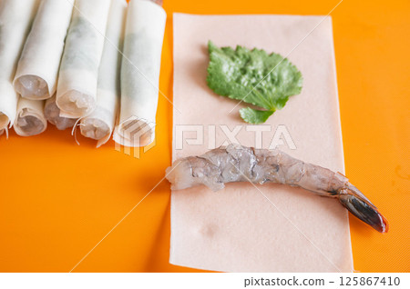 Shrimp and mitsuba wrapped in spring roll skin 125867410