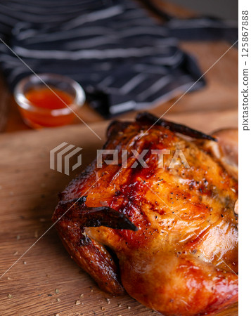 Crispy Roasted Whole Chicken Close-Up. Crispy Roasted Whole Chicken Close-Up. 125867888
