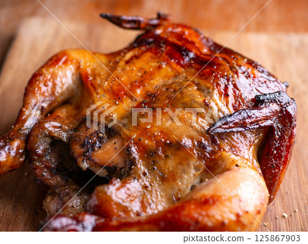 Crispy Roasted Whole Chicken Close-Up. Crispy Roasted Whole Chicken Close-Up. 125867903