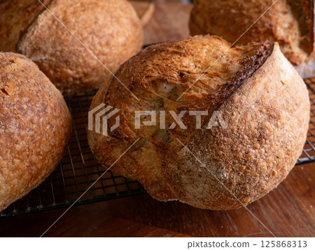 Freshly Baked Sourdough Loaf on Cafe table. 125868313