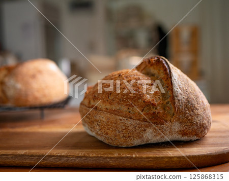 Crusty Artisan Sourdough Bread Close-Up. 125868315