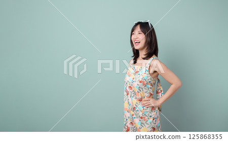 Southeast asian woman smiles confidently representing small business owner in retail and creative industry, showcasing startup spirit for online store and shopping success 125868355