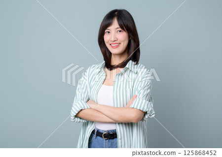 Southeast asian woman with creative smile stands confidently as small business owner in retail and online store startup industry showing success and optimism 125868452