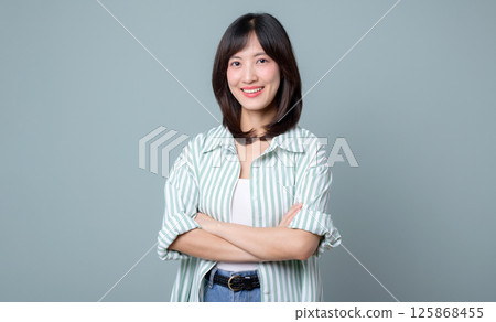 Southeast Asian woman smiling confidently as small business owner in retail and online store startup industry showing creative spirit and success in her business journey Southeast Asian woman smiling confidently as small business owner in retail and online store startup industry showing creative spirit and success in her business journey 125868455