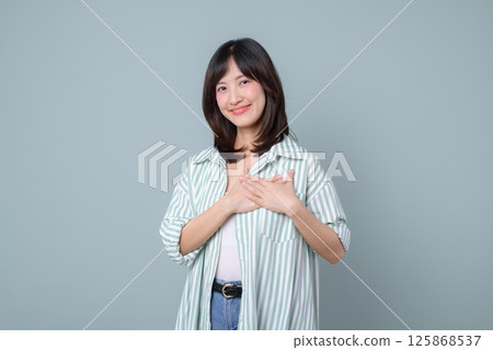 Southeast asian woman expresses gratitude with smile showing creative spirit as small business owner in retail and online store startup industry supporting shopping growth Southeast asian woman expresses gratitude with smile showing creative spirit as small business owner in retail and online store startup industry supporting shopping growth 125868537