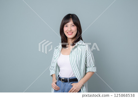 Southeast asian woman smiles confidently as small business owner in retail and online shopping industry, showcasing creative startup spirit and entrepreneurial drive Southeast asian woman smiles confidently as small business owner in retail and online shopping industry, showcasing creative startup spirit and entrepreneurial drive 125868538