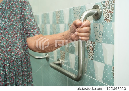 Asian elderly woman patient use walker and toilet bathroom handle security in nursing hospital, healthy strong medical. Asian elderly woman patient use walker and toilet bathroom handle security in nursing hospital, healthy strong medical. 125868620