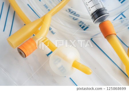 Foley urinary catheter with urine bag for disability or patient in hospital. Foley urinary catheter with urine bag for disability or patient in hospital. 125868699