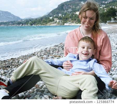 happy mother on the beach with children. lifestyle people 125868774