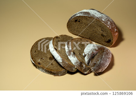 Black bread on a close-up background Black bread on a close-up background 125869106