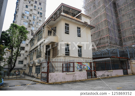 May 5 2025 Historic Church Building with Tree-Lined Grounds and Clear Sky 125869352