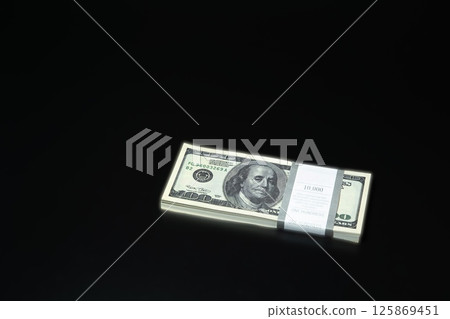 Bundles of dollars on the background 125869451
