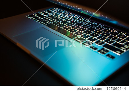 Close up of keyboard of a modern laptop. laptop backlit keyboard. Selective focus. Isolated on black Close up of keyboard of a modern laptop. laptop backlit keyboard. Selective focus. Isolated on black 125869644