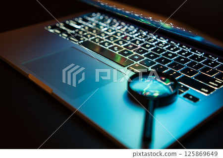 Beautiful colorful laptop keyboard. Modern laptop, isolated on black. Blurred foreground and background 125869649