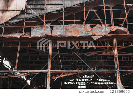 Building after fire. A half-destroyed building 125869663