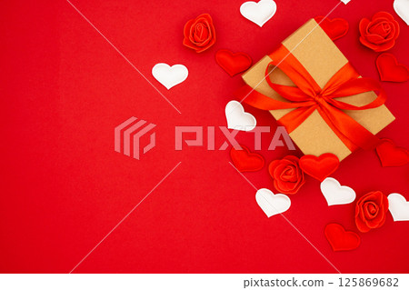Gift box in craft packaging. Template for posters and banners with copy space. Box with a gift for Birthday, Wedding, Valentine's Day, March 8. 125869682