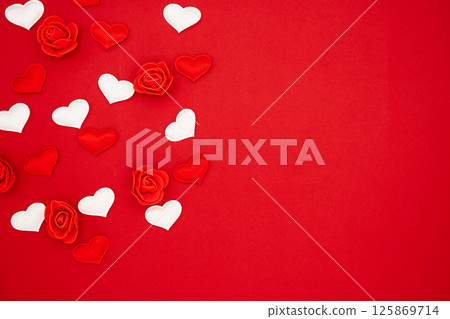Red and white hearts and roses on a red background. Love concept, copy space, flat lay, place for text, banner, top view Red and white hearts and roses on a red background. Love concept, copy space, flat lay, place for text, banner, top view 125869714