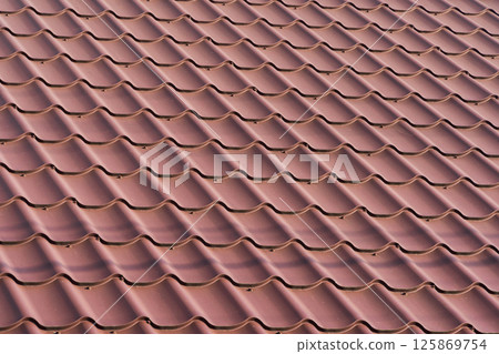 Red metal roof tiles. Metal tile Red metal roof tiles. Metal tile 125869754