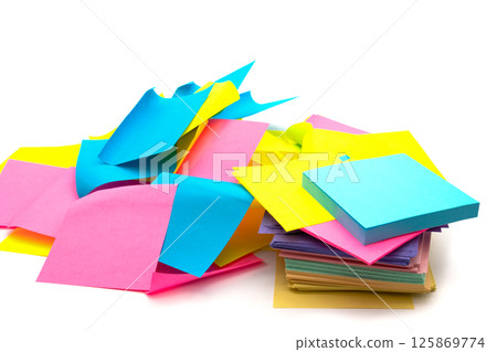 Used and new colorful sticky note paper heap isolated on white Used and new colorful sticky note paper heap isolated on white 125869774