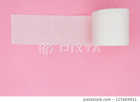 One toilet paper roll isolated on pink background. Pastel color. Hygiene concept One toilet paper roll isolated on pink background. Pastel color. Hygiene concept 125869931