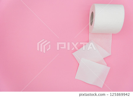 Unrolled toilet paper on color background, top view. Space for text Unrolled toilet paper on color background, top view. Space for text 125869942
