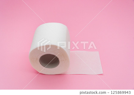 White simple toilet paper on pink background White simple toilet paper on pink background 125869943