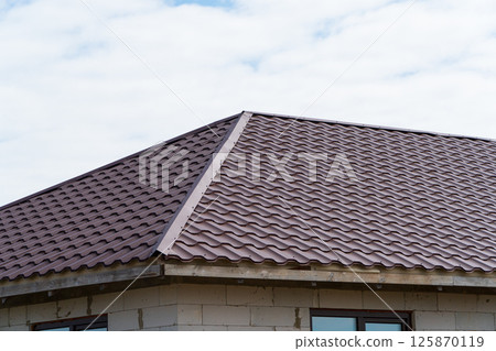 Modern roof made of metal. Modern construction 125870119
