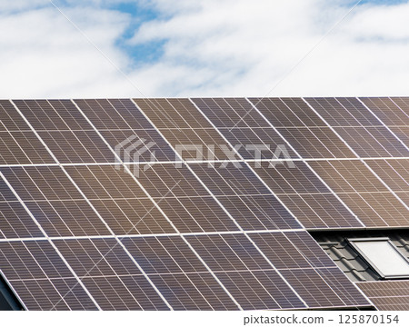 Close-up of roof with solar panels. Solar panel. Sun Energy Close-up of roof with solar panels. Solar panel. Sun Energy 125870154