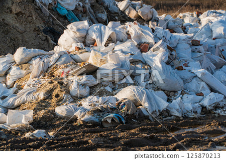 Huge landfill of garbage. Garbage or waste dumped. Garbage in the bags 125870213