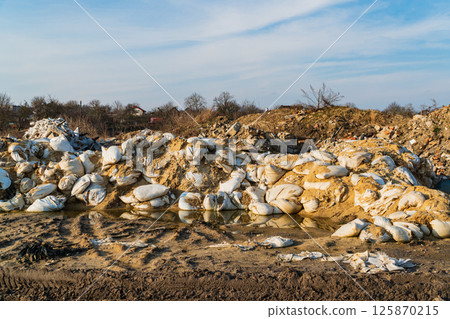 Landfill of construction waste and garbage in nature. Illegal construction waste dump 125870215