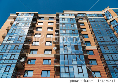 Modern apartment buildings on a sunny day with a blue sky Modern apartment buildings on a sunny day with a blue sky 125870241