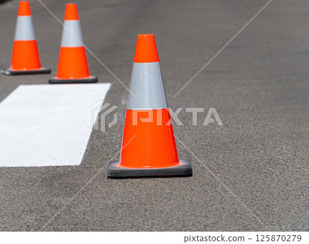 Three traffic cones on road Three traffic cones on road 125870279