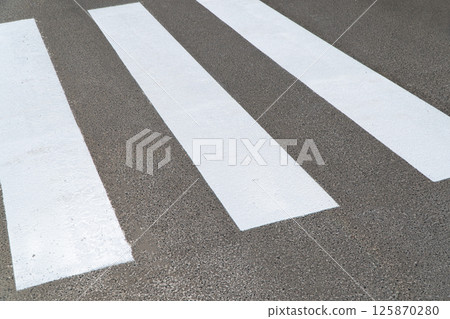 The crosswalk - zebra crossing. Crosswalks symbolize pedestrian safety 125870280