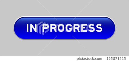Blue color capsule shape button with word in progress on gray background 125871215