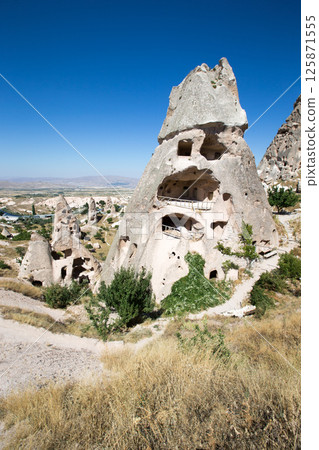 The view of the ancient cave city and fortress Uchisar, Cappadocia, Turkey The view of the ancient cave city and fortress Uchisar, Cappadocia, Turkey 125871555