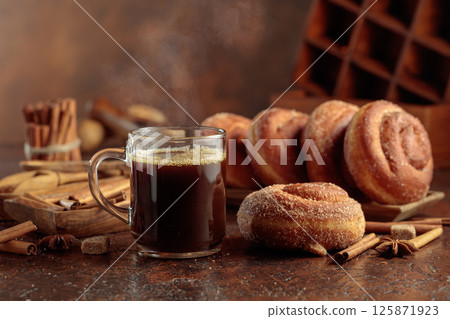 Swedish cinnamon rolls and mug of black coffee. 125871923