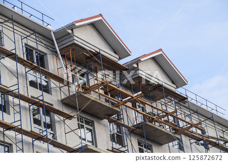 Construction of a multistorey residential building. Share constr Construction of a multistorey residential building. Share constr 125872672