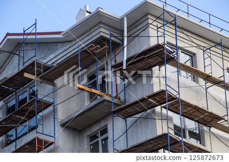 Construction of a multistorey residential building. Share constr Construction of a multistorey residential building. Share constr 125872673