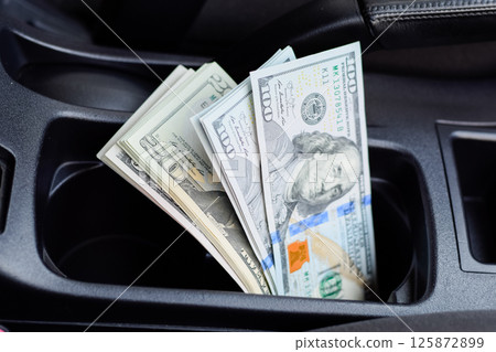 wad of dollars inside the car. 125872899
