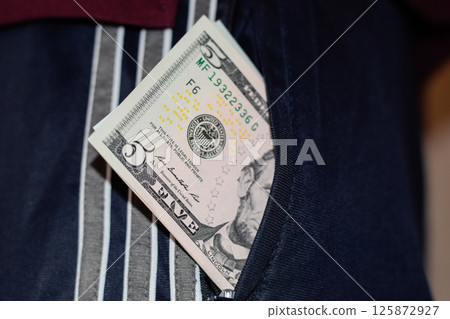 wad of money in the pocket of a man's pants. Dollars in your pocket. wad of money in the pocket of a man's pants. Dollars in your pocket. 125872927