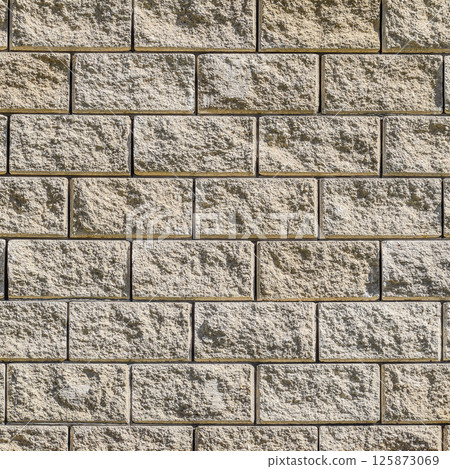Background from the wall of white brick. yellow beige brick. Brick texture. Building background. Small items 125873069