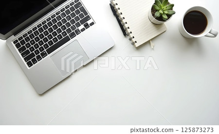 Flat lay top view of modern office desk, laptop, coffee, notebook, pen, minimalist aesthetic, natural lighting 125873273