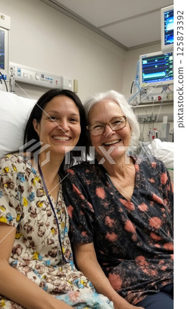 Nurse and patient connect in a warm recovery room, sharing a smile and grateful exchange, highlighting care, healing, and emotional support after treatment Nurse and patient connect in a warm recovery room, sharing a smile and grateful exchange, highlighting care, healing, and emotional support after treatment 125873392