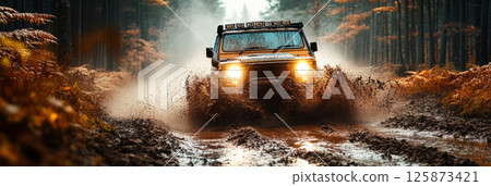 Extreme driving moment as 4x4 rips through dense misty woods, mud flying and lights cutting haze in an intense, adrenaline-driven outdoor off-road challenge, banner Extreme driving moment as 4x4 rips through dense misty woods, mud flying and lights cutting haze in an intense, adrenaline-driven outdoor off-road challenge, banner 125873421