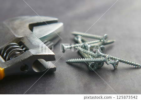 Essential tools for woodworking and home repairs on work surface 125873542