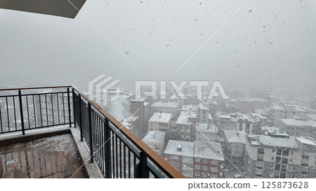 Heavy snowfall blankets city skyline on a winter morning Heavy snowfall blankets city skyline on a winter morning 125873628