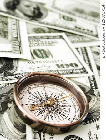 Money and compass Money and compass 125873714